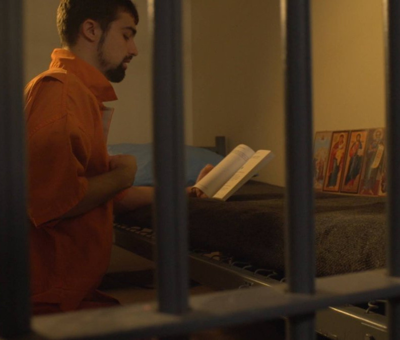 praying%20in%20jail%20cell%20ocpm%20cropped.jpg